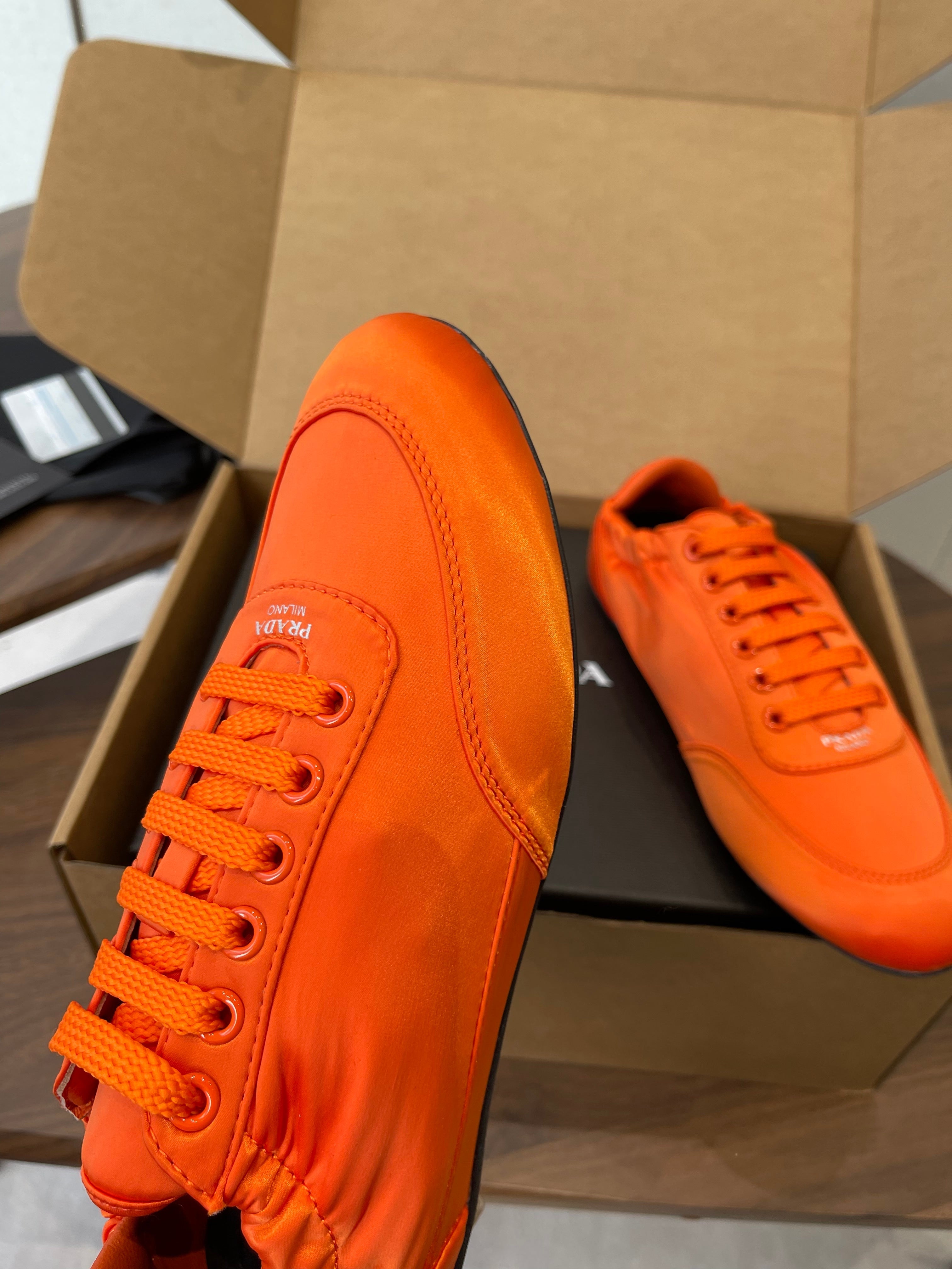 PRADA 25S SNEAKER IN ORANGE SILK
