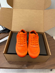 PRADA 25S SNEAKER IN ORANGE SILK
