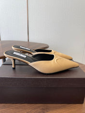 ALAIA 26S HEELED MULES 50 MM IN WARM BEIGE FABRIC