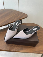 ALAIA 26S HEELED MULES 50 MM IN LAVENDER GREY FABRIC