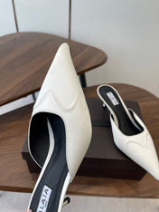 ALAIA 26S HEELED MULES 50 MM IN WHITE FABRIC