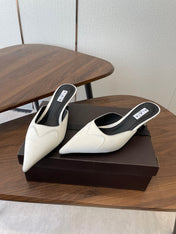 ALAIA 26S HEELED MULES 50 MM IN WHITE FABRIC