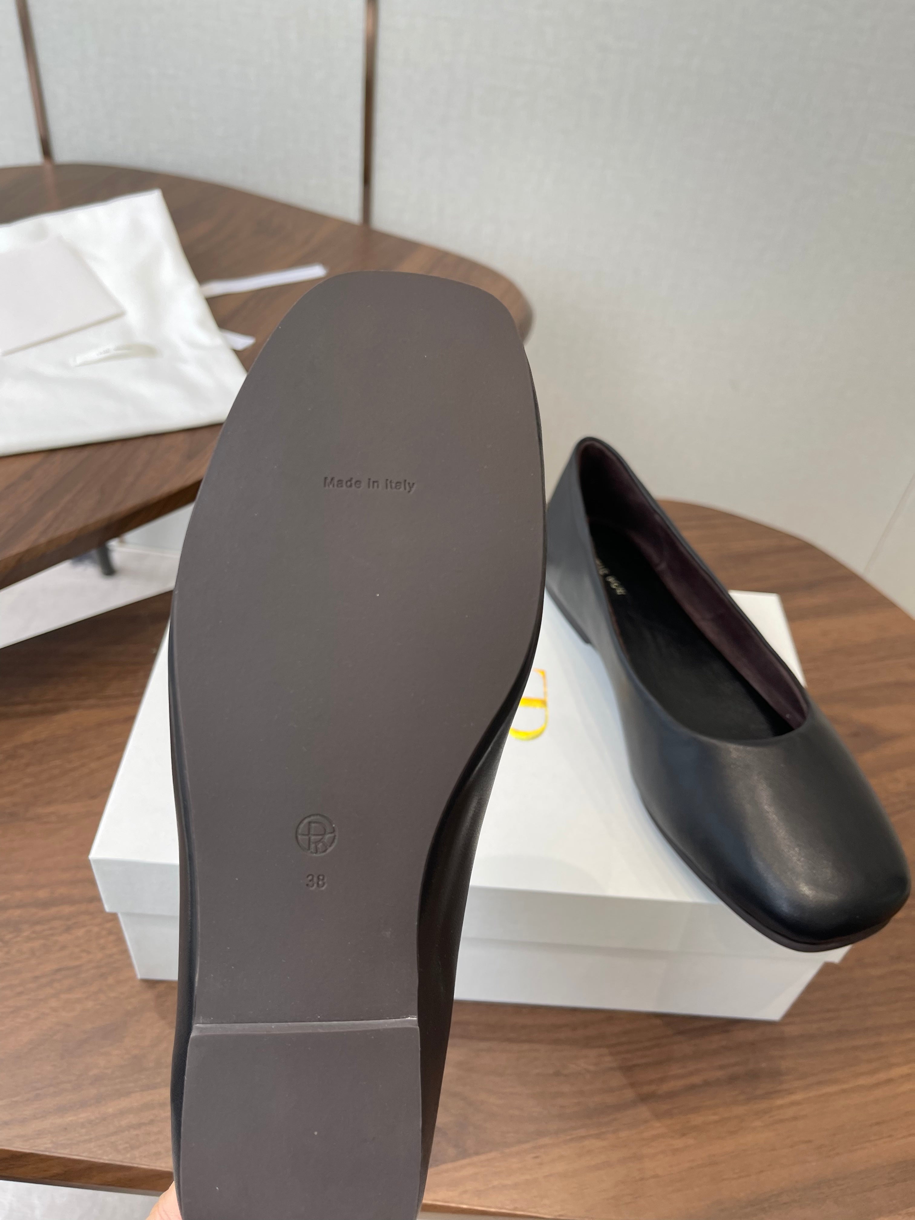 THE ROW 26S FLATS IN BLACK CALFSKIN