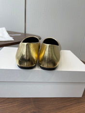 THE ROW 26S FLATS IN GOLD CALFSKIN