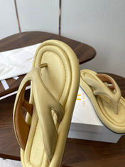 THE ROW 26S PUFFED THONG SANDALS IN BUTTER YELLOW CALFSKIN