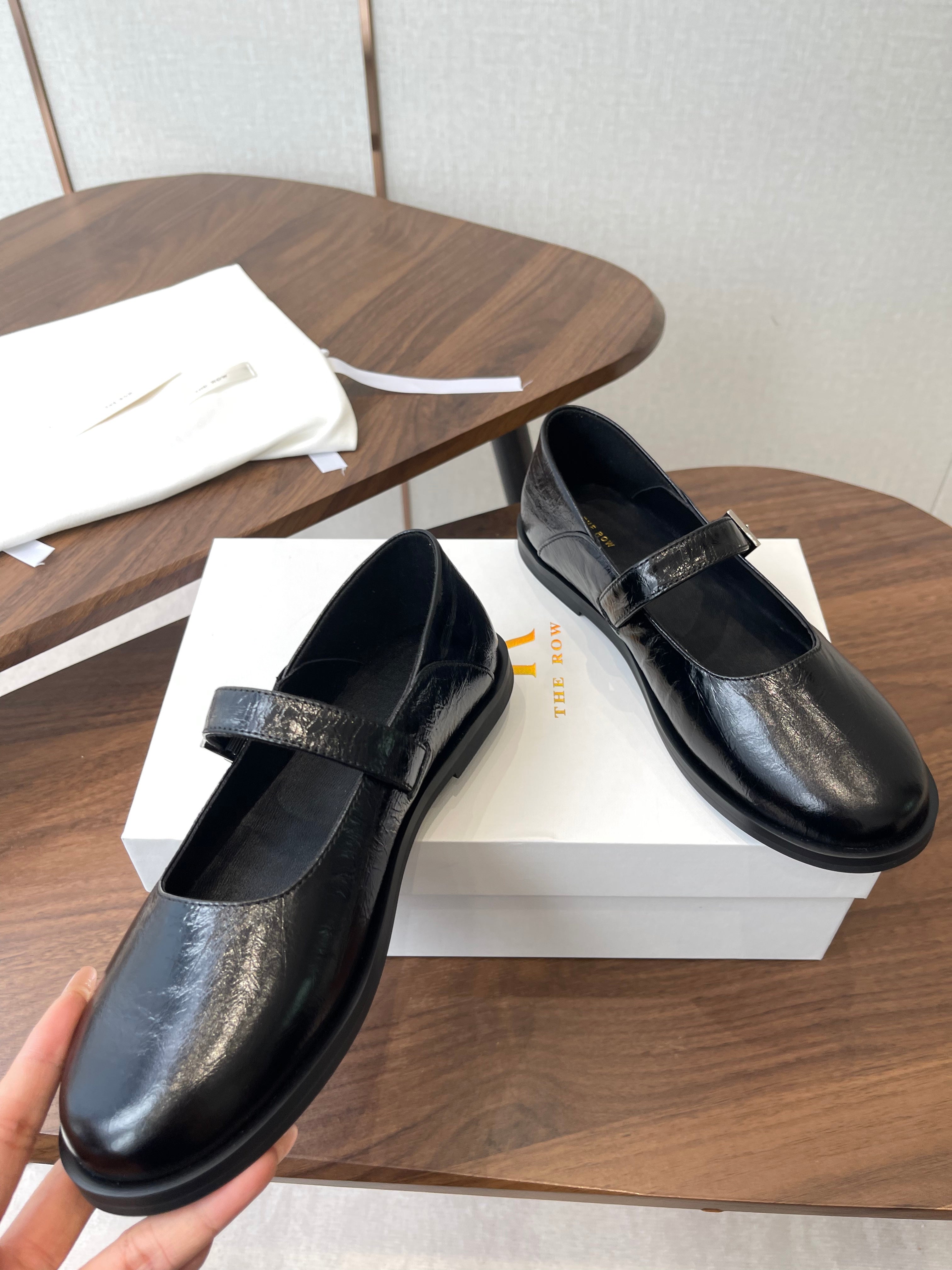 THE ROW 26S MARY JANE FLATS IN BLACK PATENT CALFSKIN