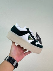 PRADA 26S DOWNTOWN THICK SOLE SNEAKERS IN WHITE CALFSKIN AND BLACK SUEDE