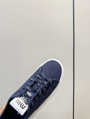 MIUMIU 26S SNEAKER MULES IN NAVY BLUE CANVAS