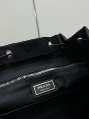 PRADA 25S EXPLORE BACKPACK 39 IN BLACK RE-NYLON AND CALFSKIN