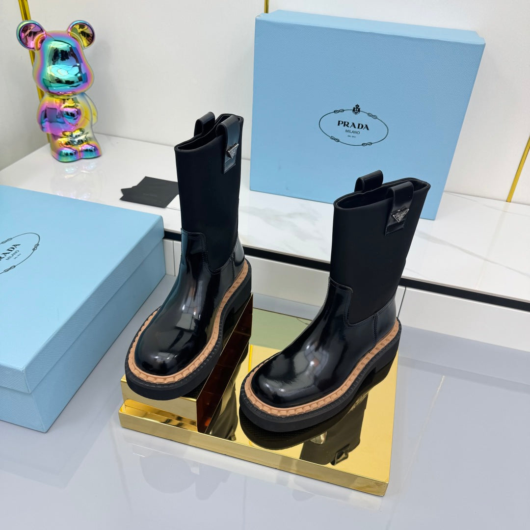 PRADA 25S HIGH MARTIN BOOTS 50MM IN BLACK GLOSSY CALFSKIN