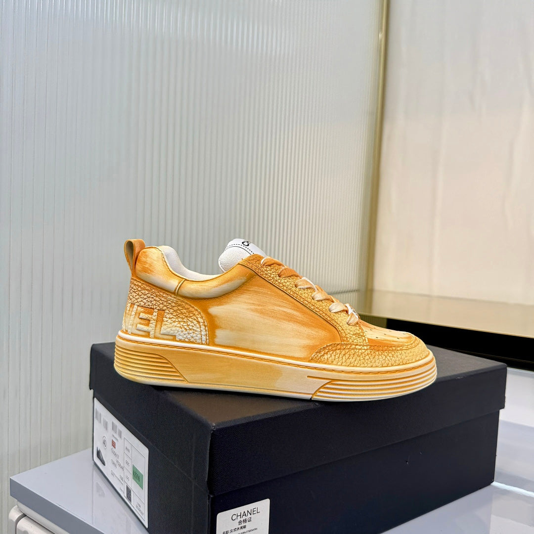 CHANEL 26S LOW-TOP SNEAKERS IN GOLDEN ORANGE CALFSKIN