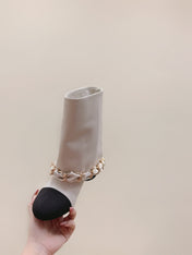 CHANEL 25S CALF-LENGTH BOOTS 45MM IN WHITE AND BLACK CALFSKIN GOLD HARDWARE