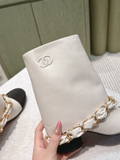 CHANEL 25S CALF-LENGTH BOOTS 45MM IN WHITE AND BLACK CALFSKIN GOLD HARDWARE