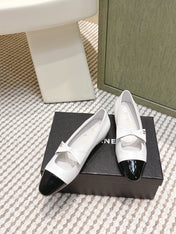 CHANEL 25S MARY JANE BALLET FLATS IN WHITE LAMBSKIN BLACK PATENT CAP TOE WITH BOW
