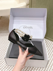 CHANEL 25S ESPADRILLE FLATS IN BLACK CALFSKIN WITH PEARL STRAP