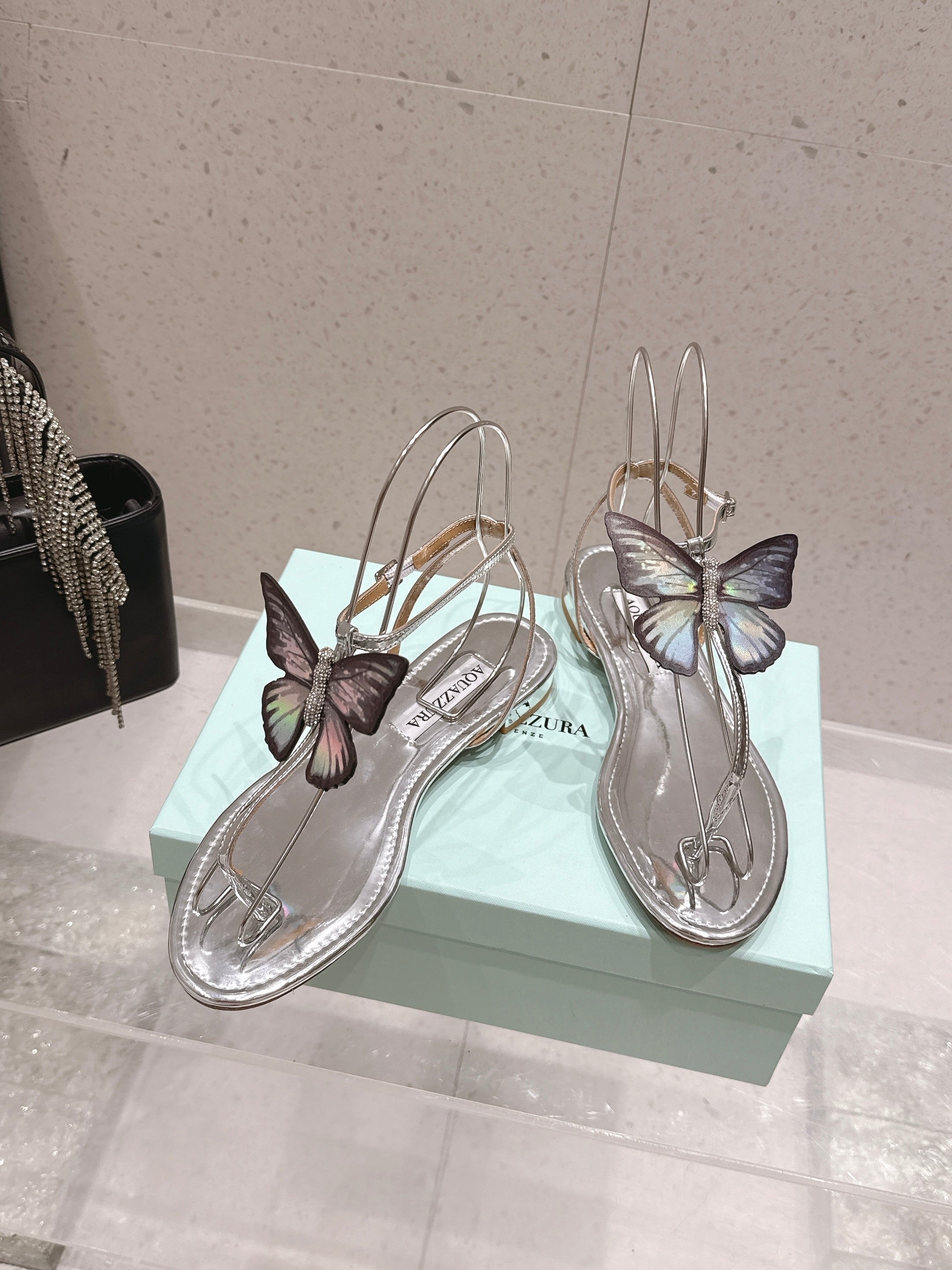 AQUAZZURA 26S BUTTERFLY THONG SANDALS IN SILVER LAMBSKIN