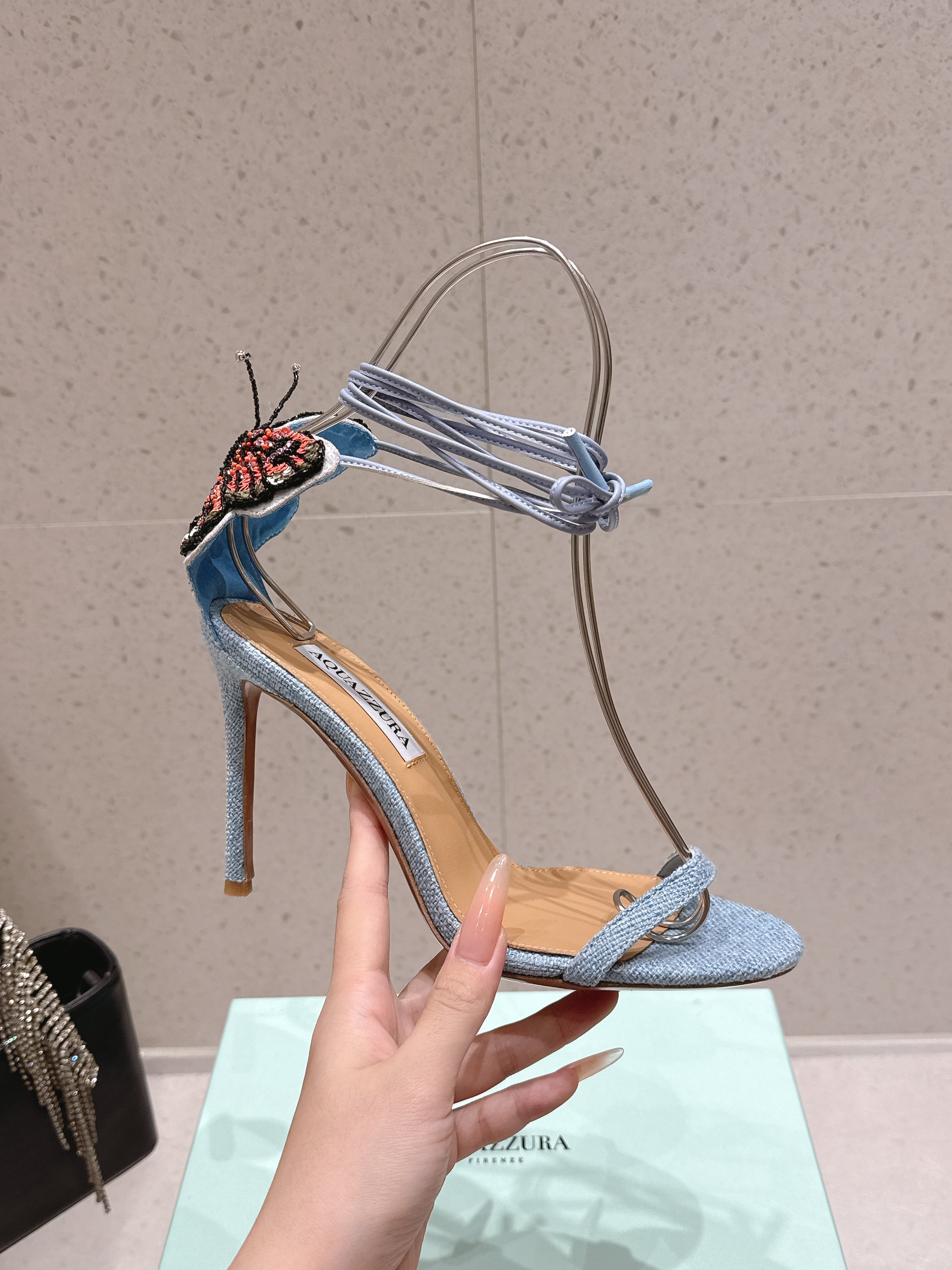 AQUAZZURA 26S BUTTERFLY LACE-UP HEELS 100 MM IN PASTEL BLUE FABRIC