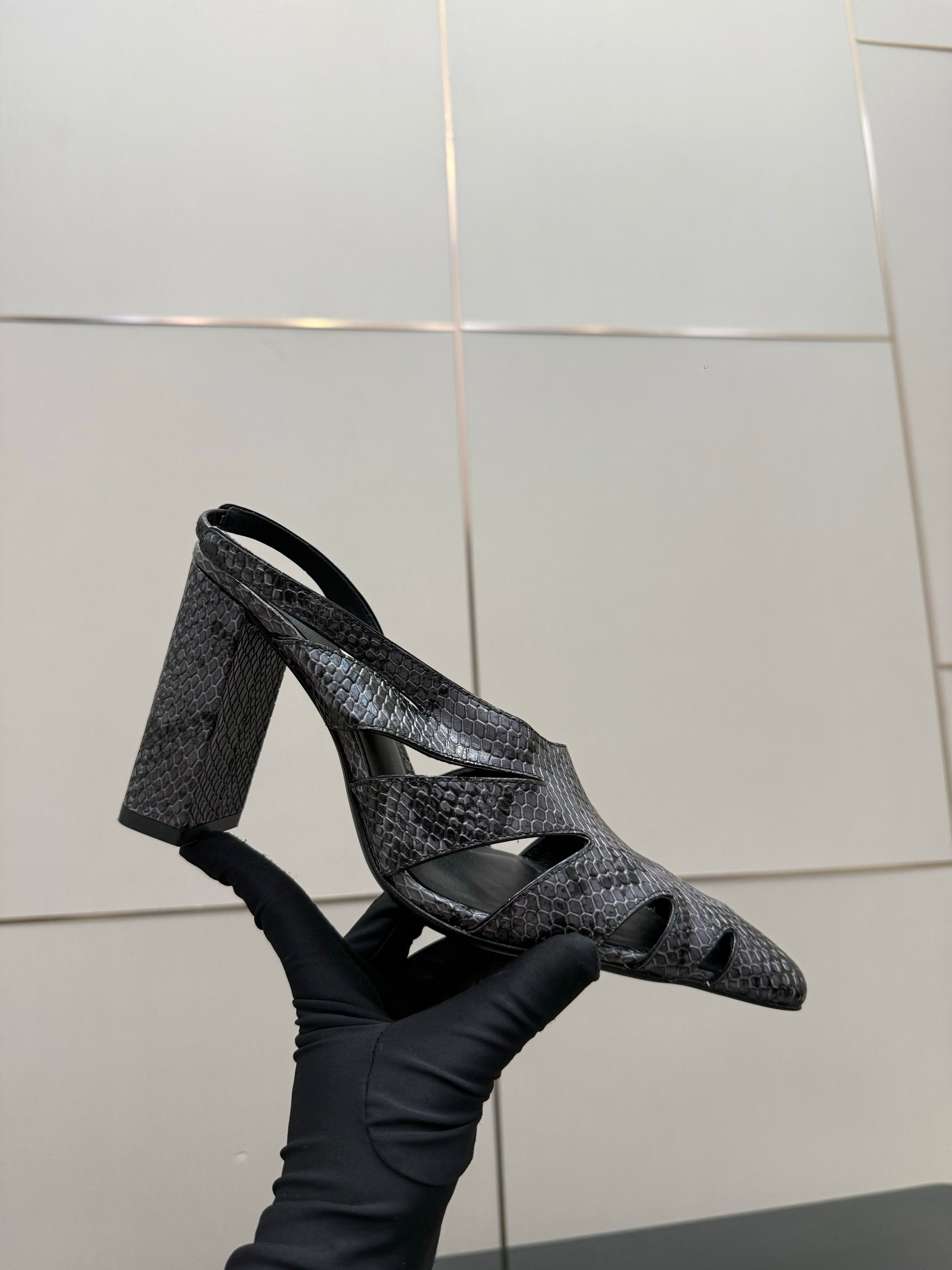 ALAIA 26S HEELED SLINGBACKS IN BLACK PYTHON-EMBOSSED LEATHER