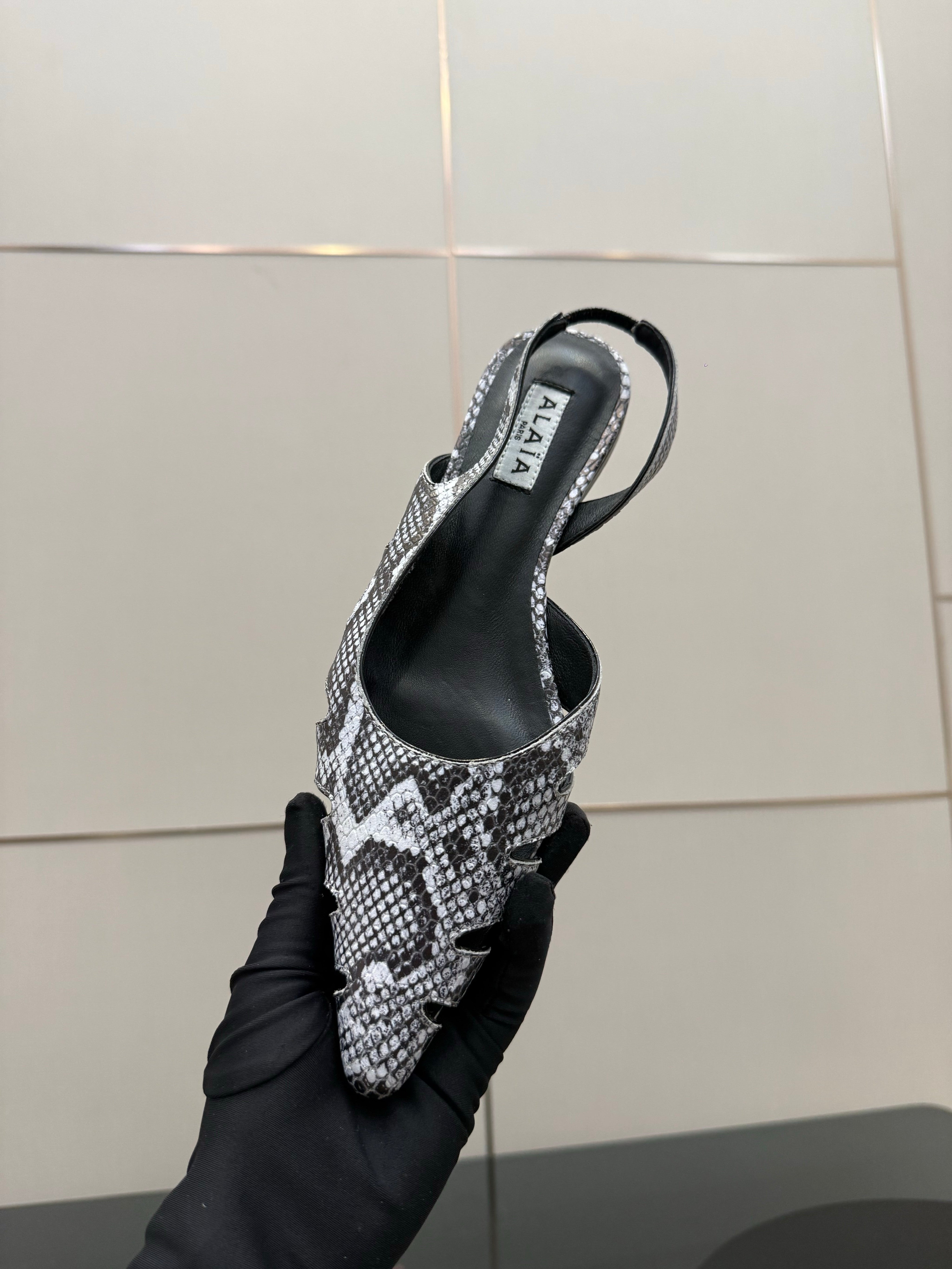 ALAIA 26S CUT-OUT SLINGBACK FLATS IN PYTHON-EMBOSSED LEATHER