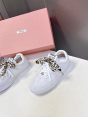 MIUMIU 25S SNEAKERS IN WHITE SUEDE WITH LEOPARD-PRINT LACES