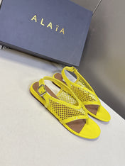 ALAIA 26S FLAT MESH THONG SANDALS IN YELLOW PATENT CALFSKIN