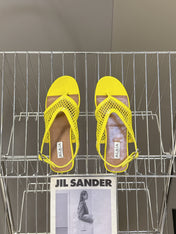 ALAIA 26S FLAT MESH THONG SANDALS IN YELLOW PATENT CALFSKIN