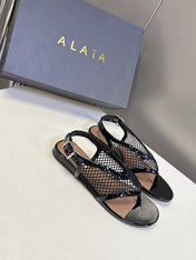 ALAIA 26S FLAT MESH THONG SANDALS IN BLACK PATENT CALFSKIN