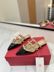 VALENTINO 26S STUDDED FLAT MULES IN BLACK PATENT CALFSKIN