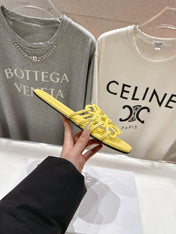 LOEWE 26S PETAL ANAGRAM SLIDE IN YELLOW CALFSKIN