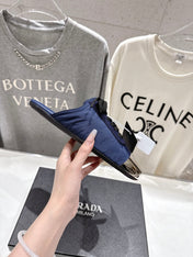 PRADA 25S MULES IN DARK BLUE WITH METAL TOECAP