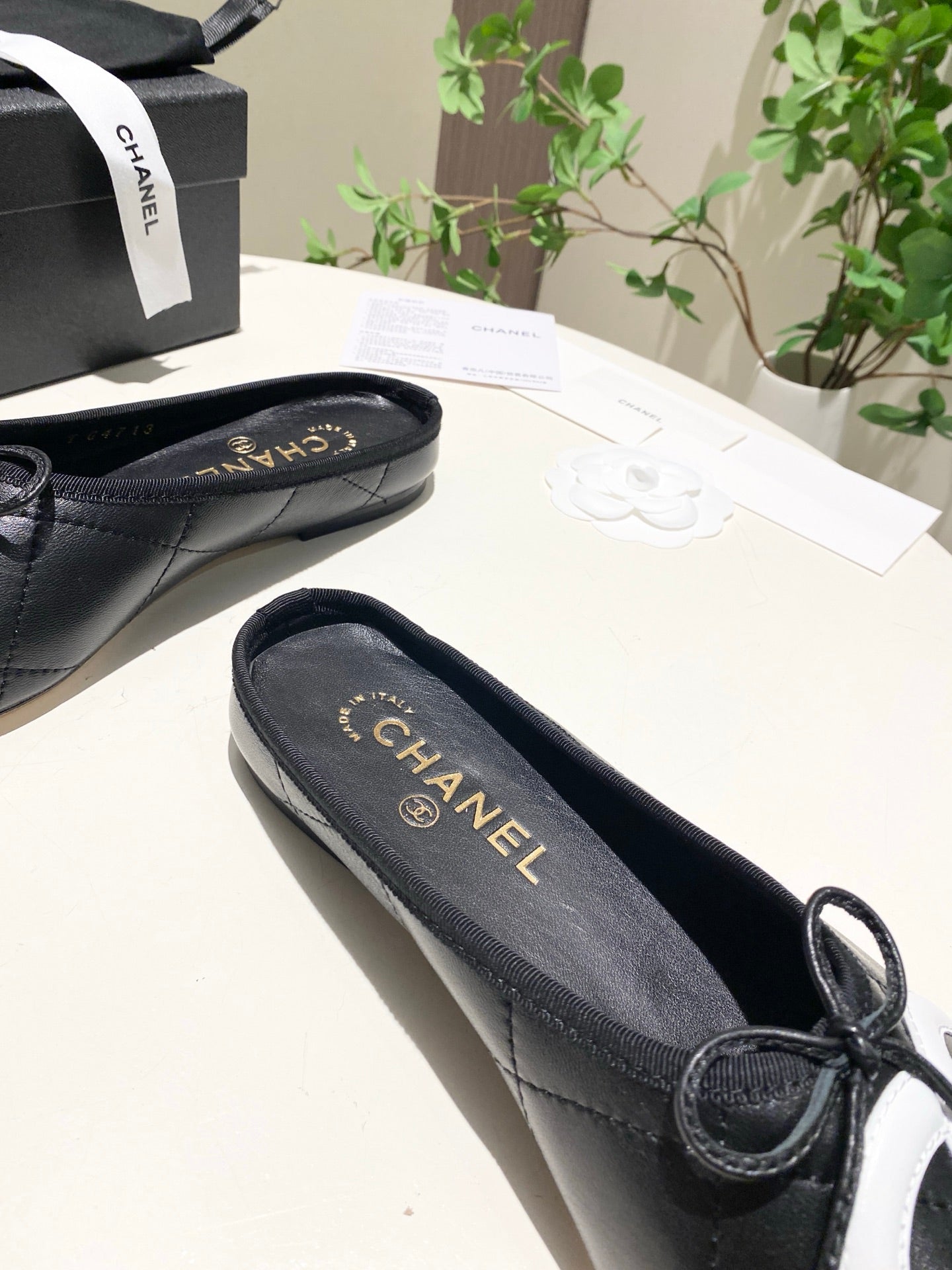 CHANEL 26S FLAT MULES IN BLACK LAMBSKIN