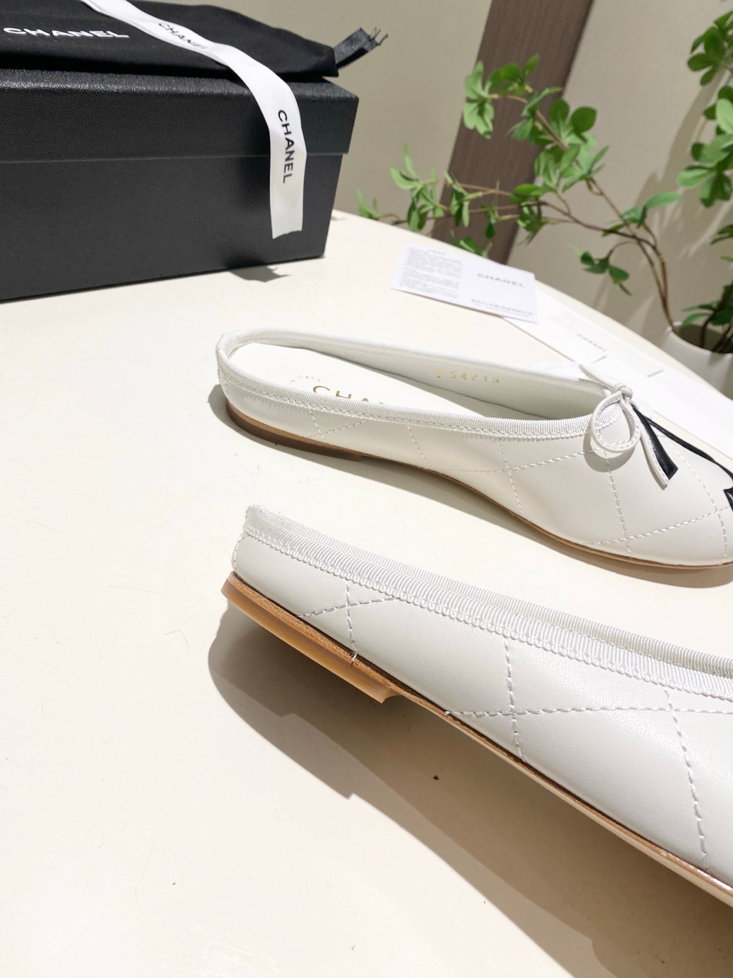 CHANEL 26S FLAT MULES IN WHITE LAMBSKIN