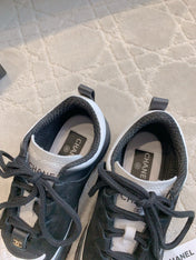 CHANEL 25S TRAINERS 40MM IN BLACK AND WHITE CALFSKIN AND SUEDE