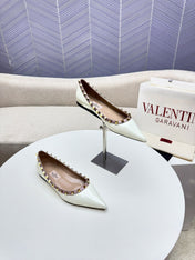 ROCKSTUD FLAT PUMP IN WHITE CALFSKIN