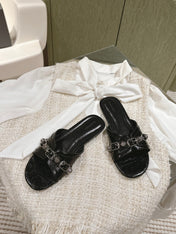 CAGOLE FLAT SANDALS IN BLACK WAX-OIL SHEEPSKIN