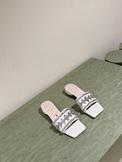 TRUMPET METALLIC MULES IN WHITE SMOOTH CALFSKIN WITH EMBELLISHED BUCKLE