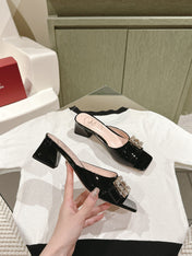 CRYSTAL HEEL MULE IN BLACK PATENT CALFSKIN WITH EMBELLISHED BUCKLE