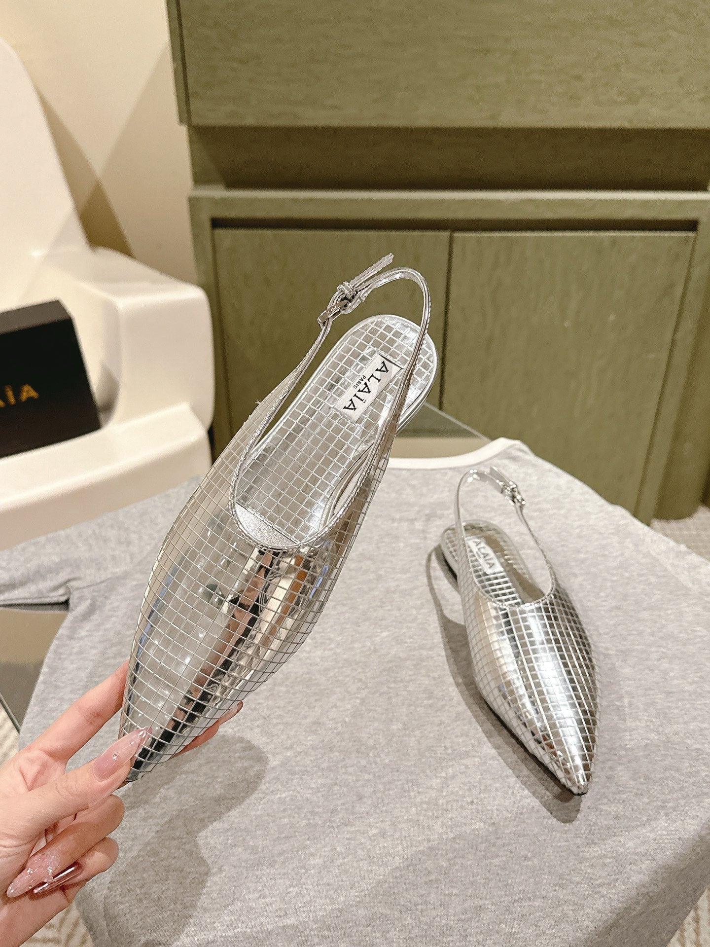 ALAIA SLINGBACK 25S IN SILVER PATENT LEATHER