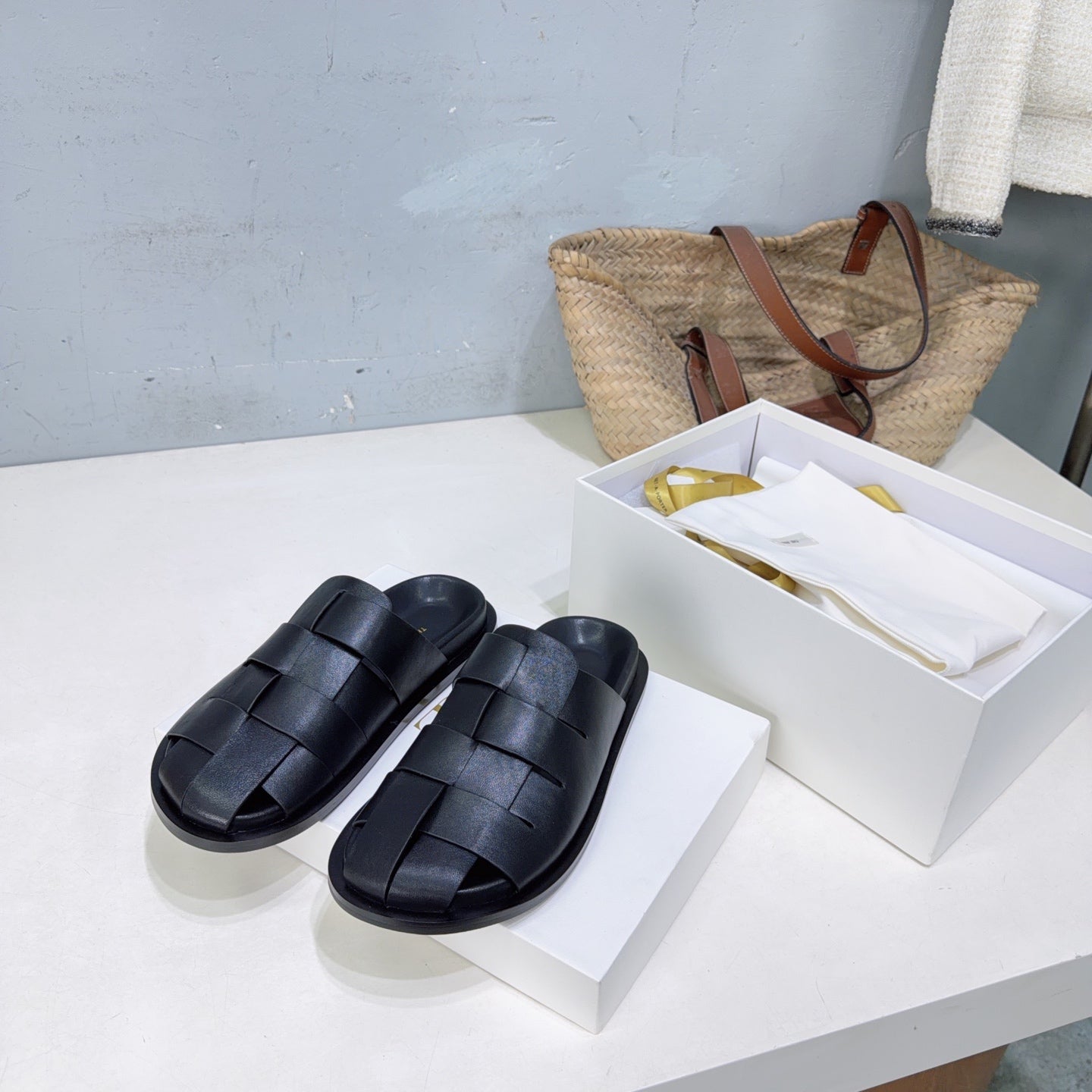 THE ROW 26S CAGE SLIDES IN BLACK SMOOTH CALFSKIN