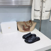 THE ROW 26S CAGE SLIDES IN BLACK SMOOTH CALFSKIN