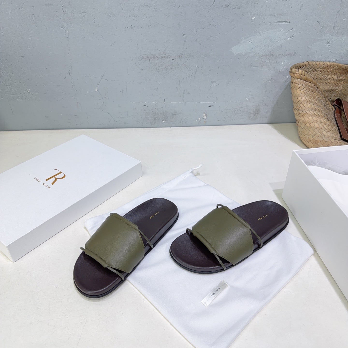 THE ROW 26S STRAP SLIDES IN OLIVE GREEN CALFSKIN