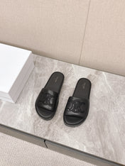 THICK-SOLED SLIDES IN BLACK SMOOTH LAMBSKIN LOGO WITH CRYSTALS