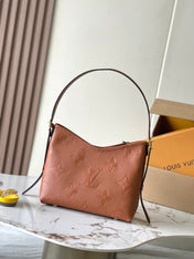 CARRYALL PM 29 IN COGNAC MONOGRAM EMPREINTE LEATHER GOLD LOGO