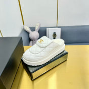 THICK-SOLED SLIDE IN WHITE LAMBSKIN AND WOOL LINING