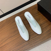 ALAIA 26S WEDGE MULES 70 MM IN WHITE GLOSSY CALFSKIN