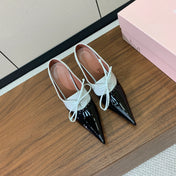 ALAIA 26S LACE-UP HEELED 105 MM IN BLACK AND WHITE GLOSSY CALFSKIN