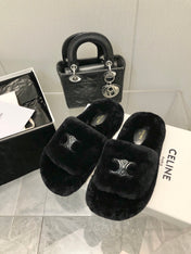 THICK-SOLED SLIPPER IN BLACK LAMB FUR
