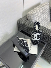 CHANEL 26S PLATFORM SLIDE SANDALS IN BLACK SHEARLING AND WHITE CC LOGO SQUARE TOE