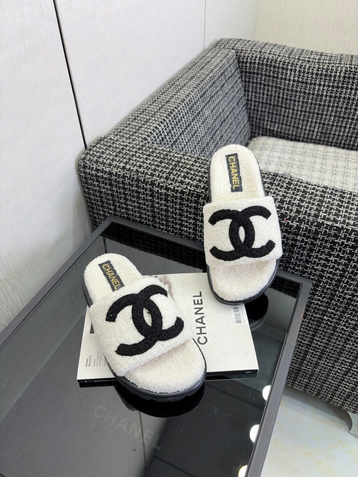 CHANEL 26S SLIDE SANDALS  IN BLACK AND WHITE SHEARLING