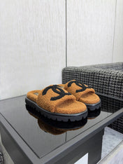 CHANEL 26S SLIDE SANDALS IN BLACK AND CAMEL SHEARLING OPEN TOE